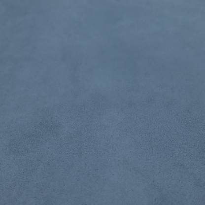 Annecy Water Repellent Velvet in Steel Blue. The fabric features a dense, plush pile with a soft matte finish in a sophisticated, mid-toned greyish-blue. This high-performance upholstery material offers a luxurious feel and a specialized water-resistant coating for superior durability and a calm, modern look.