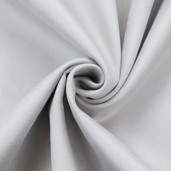 Annecy Water Repellent Velvet in Silver. The fabric features a dense, plush pile with a soft matte finish in a bright, clean light grey. This high-performance upholstery material offers a luxurious texture and a specialized water-resistant coating for a modern, durable aesthetic.