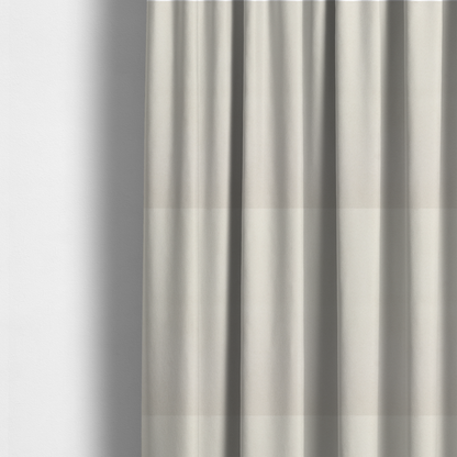 The fabric used to create these made-to-measure curtains features a dense, plush pile with a clean, matte finish in a brilliant pure white. This high-performance upholstery material offers a luxurious feel and a specialized water-resistant coating for superior durability.