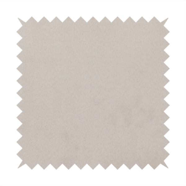 Annecy Water Repellent Velvet in Dove Grey. The fabric features a dense, plush pile with a soft matte finish in a sophisticated, pale neutral grey. This high-performance upholstery material offers a luxurious feel and a specialized water-resistant coating for superior durability and a timeless, elegant look.