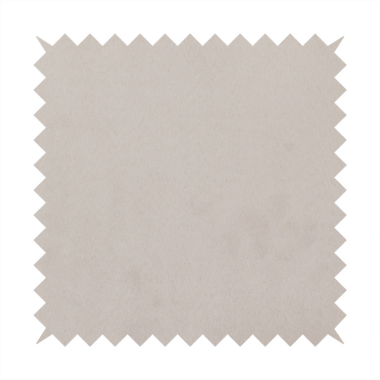 Annecy Water Repellent Velvet in Dove Grey. The fabric features a dense, plush pile with a soft matte finish in a sophisticated, pale neutral grey. This high-performance upholstery material offers a luxurious feel and a specialized water-resistant coating for superior durability and a timeless, elegant look.