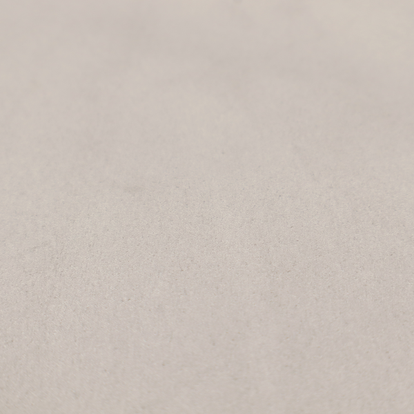 Annecy Water Repellent Velvet in Dove Grey. The fabric features a dense, plush pile with a soft matte finish in a sophisticated, pale neutral grey. This high-performance upholstery material offers a luxurious feel and a specialized water-resistant coating for superior durability and a timeless, elegant look.