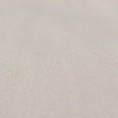 Annecy Water Repellent Velvet in Dove Grey. The fabric features a dense, plush pile with a soft matte finish in a sophisticated, pale neutral grey. This high-performance upholstery material offers a luxurious feel and a specialized water-resistant coating for superior durability and a timeless, elegant look.