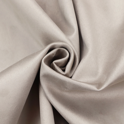 Annecy Water Repellent Velvet in Dove Grey. The fabric features a dense, plush pile with a soft matte finish in a sophisticated, pale neutral grey. This high-performance upholstery material offers a luxurious feel and a specialized water-resistant coating for superior durability and a timeless, elegant look.