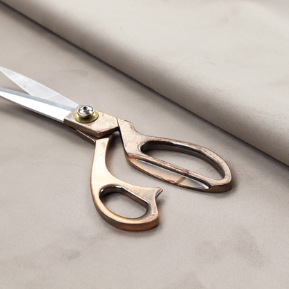 Annecy Water Repellent Velvet in Dove Grey. The fabric features a dense, plush pile with a soft matte finish in a sophisticated, pale neutral grey. This high-performance upholstery material offers a luxurious feel and a specialized water-resistant coating for superior durability and a timeless, elegant look.