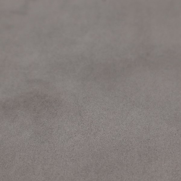 Annecy Water Repellent Velvet in Storm. The fabric features a dense, uniform pile with a soft matte finish in a deep, moody brownish-grey. This high-performance upholstery material offers a luxurious texture and a specialized water-resistant coating for a sophisticated, durable finish.