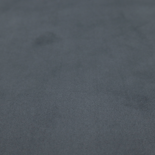 Annecy Water Repellent Velvet in Seal Grey. The fabric features a dense, plush pile with a soft matte finish in a sophisticated mid-to-dark neutral grey. This high-performance upholstery material offers a luxurious feel and a specialized water-resistant coating for superior durability and a sleek, modern aesthetic.