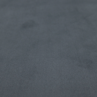 Annecy Water Repellent Velvet in Seal Grey. The fabric features a dense, plush pile with a soft matte finish in a sophisticated mid-to-dark neutral grey. This high-performance upholstery material offers a luxurious feel and a specialized water-resistant coating for superior durability and a sleek, modern aesthetic.