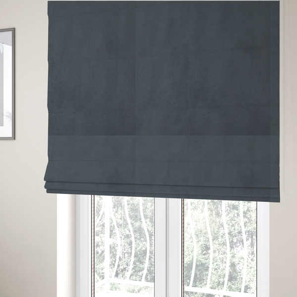 The fabric used to create these Roman blinds features a dense, plush pile with a soft matte finish in a sophisticated mid-to-dark neutral grey. This high-performance upholstery material offers a luxurious feel and a specialized water-resistant coating for superior durability and a sleek, modern aesthetic.