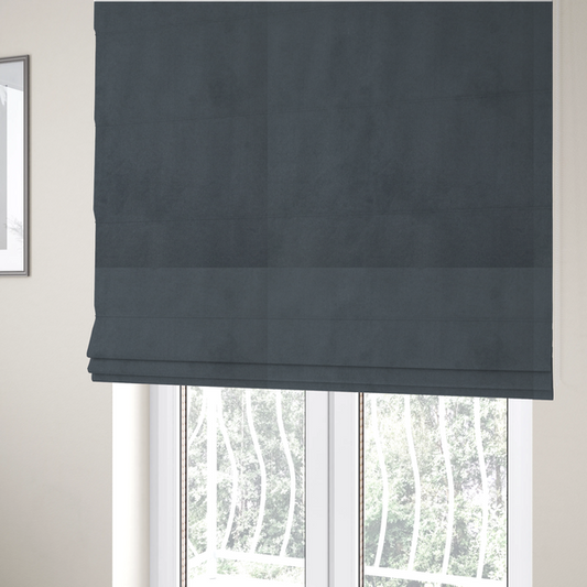 The fabric used to create these Roman blinds features a dense, plush pile with a soft matte finish in a sophisticated mid-to-dark neutral grey. This high-performance upholstery material offers a luxurious feel and a specialized water-resistant coating for superior durability and a sleek, modern aesthetic.