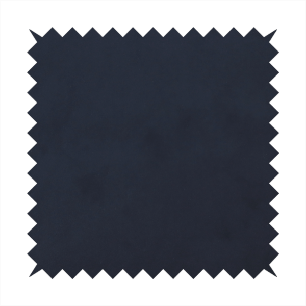 Annecy Water Repellent Velvet in Navy. The fabric showcases a dense, uniform pile with a soft matte finish in a deep, midnight blue. This high-performance upholstery material combines a luxurious texture with a specialized water-resistant coating for a sophisticated and durable finish.