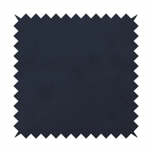Annecy Water Repellent Velvet in Navy. The fabric showcases a dense, uniform pile with a soft matte finish in a deep, midnight blue. This high-performance upholstery material combines a luxurious texture with a specialized water-resistant coating for a sophisticated and durable finish.