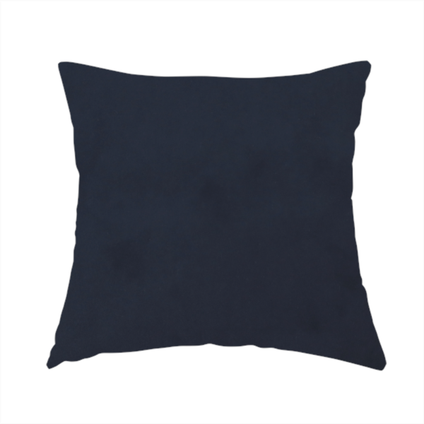 The fabric used to create this handmade cushion showcases a dense, uniform pile with a soft matte finish in a deep, midnight blue. This high-performance upholstery material combines a luxurious texture with a specialized water-resistant coating for a sophisticated and durable finish.