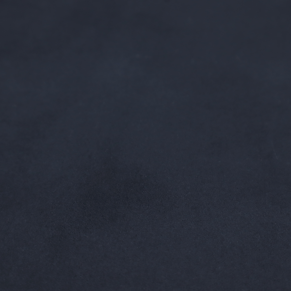 Annecy Water Repellent Velvet in Navy. The fabric showcases a dense, uniform pile with a soft matte finish in a deep, midnight blue. This high-performance upholstery material combines a luxurious texture with a specialized water-resistant coating for a sophisticated and durable finish.