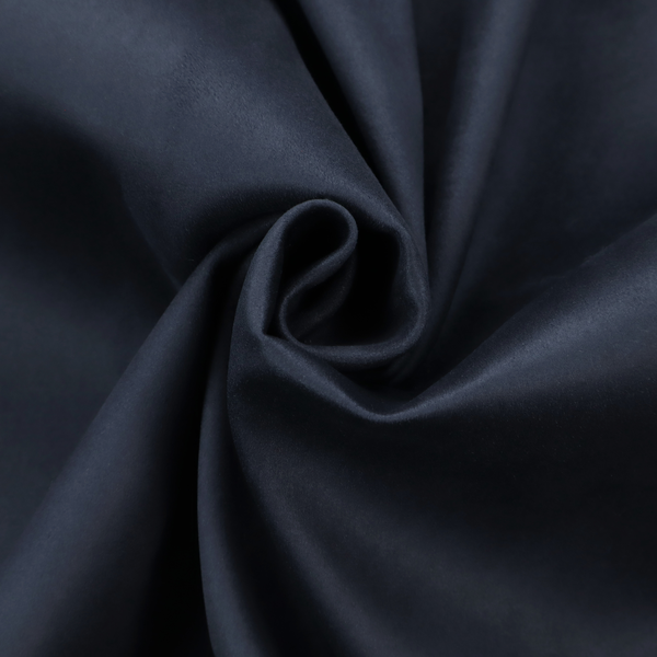 Annecy Water Repellent Velvet in Navy. The fabric showcases a dense, uniform pile with a soft matte finish in a deep, midnight blue. This high-performance upholstery material combines a luxurious texture with a specialized water-resistant coating for a sophisticated and durable finish.