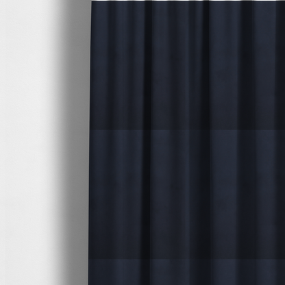 The fabric used to create these made-to-measure curtains showcases a dense, uniform pile with a soft matte finish in a deep, midnight blue. This high-performance upholstery material combines a luxurious texture with a specialized water-resistant coating for a sophisticated and durable finish.