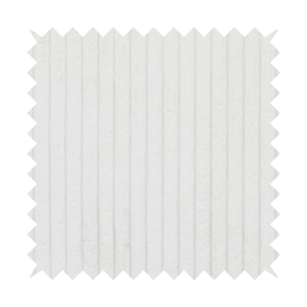This fabric is a white corduroy with a consistent vertical ribbed texture.