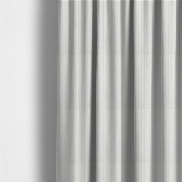 The fabric used to create these made-to-measure curtains is a white corduroy with a consistent vertical ribbed texture.