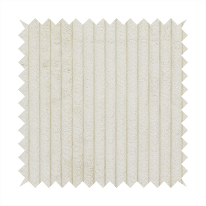 This fabric is an off-white or cream-coloured corduroy featuring a consistent, vertical ribbed texture.