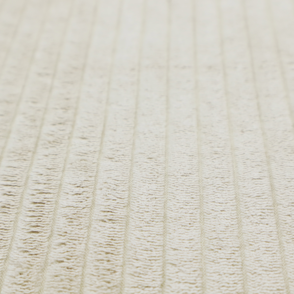This fabric is an off-white or cream-coloured corduroy featuring a consistent, vertical ribbed texture.