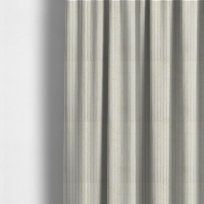 The fabric used to create these made-to-measure curtains is a off-white or cream-coloured corduroy featuring a consistent, vertical ribbed texture.