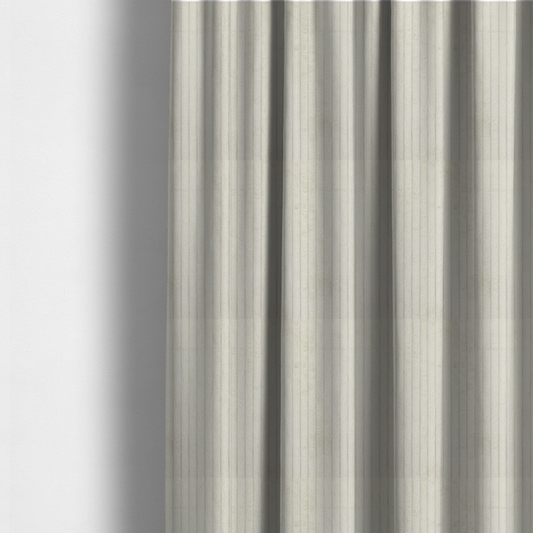 The fabric used to create these made-to-measure curtains is a off-white or cream-coloured corduroy featuring a consistent, vertical ribbed texture.
