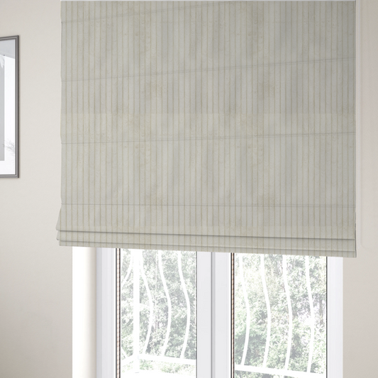 The fabric used to create these Roman blinds is an off-white or cream-coloured corduroy featuring a consistent, vertical ribbed texture.