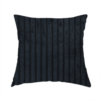 The fabric used to create this handmade cushion is a dark charcoal or black corduroy with a consistent vertical ribbed texture.
