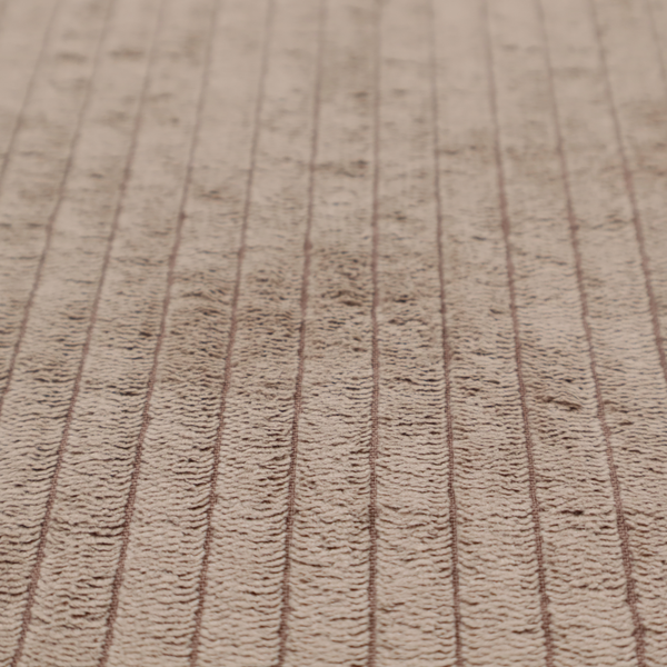 This fabric is a beige or light taupe corduroy featuring a consistent vertical ribbed texture.