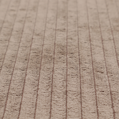 This fabric is a beige or light taupe corduroy featuring a consistent vertical ribbed texture.