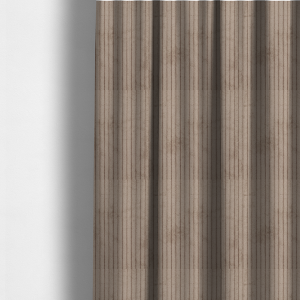The fabric used to create these made-to-measure curtains is a beige or light taupe corduroy featuring a consistent vertical ribbed texture.