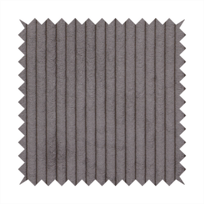 This fabric is a cool brown corduroy featuring a consistent vertical ribbed texture.