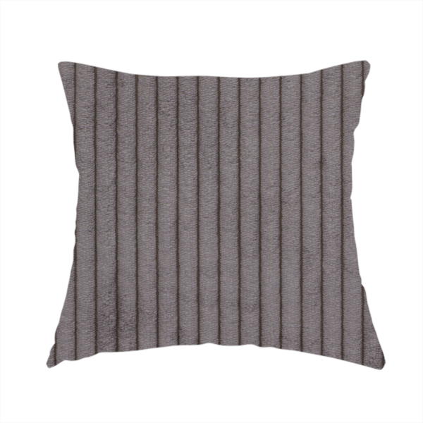 The fabric used to create this handmade cushion is a cool brown corduroy featuring a consistent vertical ribbed texture.