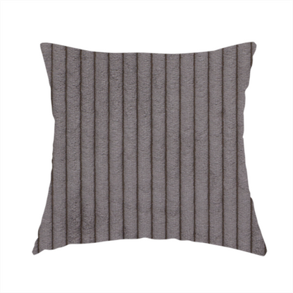 The fabric used to create this handmade cushion is a cool brown corduroy featuring a consistent vertical ribbed texture.