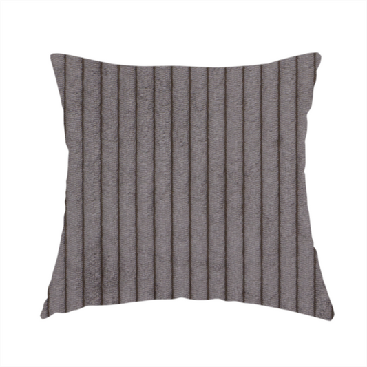 The fabric used to create this handmade cushion is a cool brown corduroy featuring a consistent vertical ribbed texture.