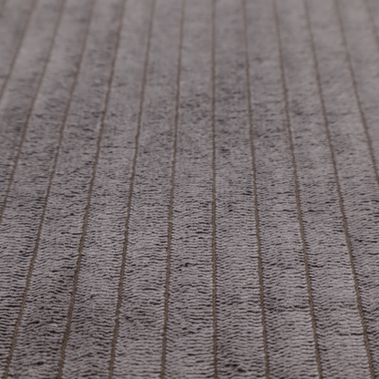 This fabric is a cool brown corduroy featuring a consistent vertical ribbed texture.