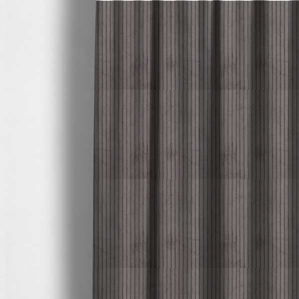 The fabric used to create these made-to-measure curtains is a cool brown corduroy featuring a consistent vertical ribbed texture.