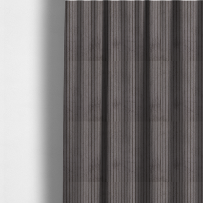 The fabric used to create these made-to-measure curtains is a cool brown corduroy featuring a consistent vertical ribbed texture.