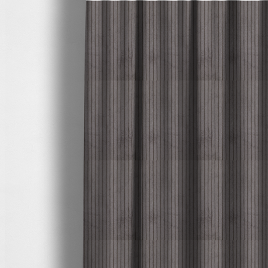 The fabric used to create these made-to-measure curtains is a cool brown corduroy featuring a consistent vertical ribbed texture.