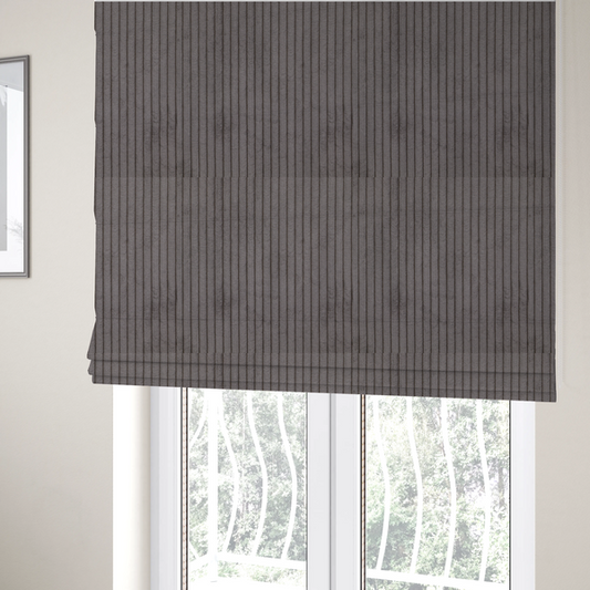 The fabric used to create these Roman blinds is a cool brown corduroy featuring a consistent vertical ribbed texture.