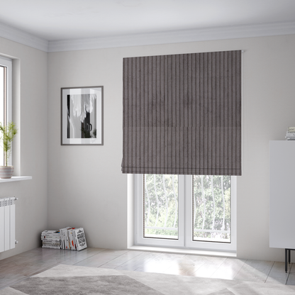 The fabric used to create these Roman blinds is a cool brown corduroy featuring a consistent vertical ribbed texture.