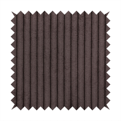 This fabric is a dark chocolate brown corduroy featuring a consistent vertical ribbed texture.