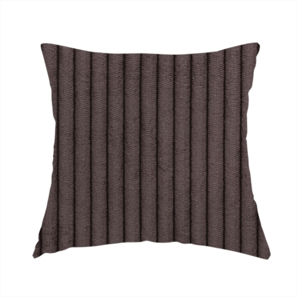 The fabric used to create this handmade cushion is a dark chocolate brown corduroy featuring a consistent vertical ribbed texture.