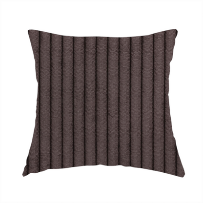 The fabric used to create this handmade cushion is a dark chocolate brown corduroy featuring a consistent vertical ribbed texture.