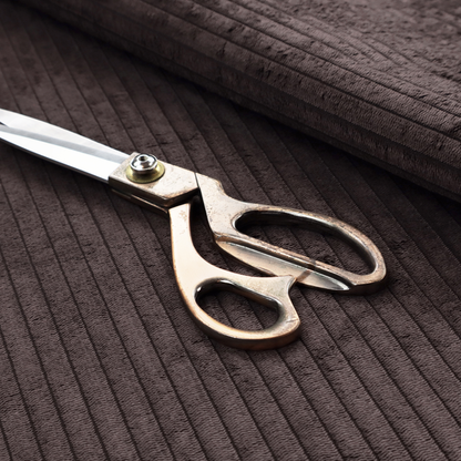 This fabric is a dark chocolate brown corduroy featuring a consistent vertical ribbed texture.