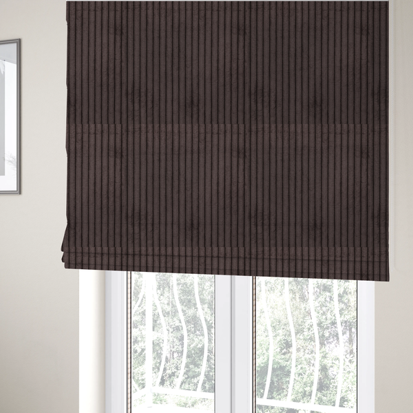 The fabric used to create these Roman blinds is a dark chocolate brown corduroy featuring a consistent vertical ribbed texture.