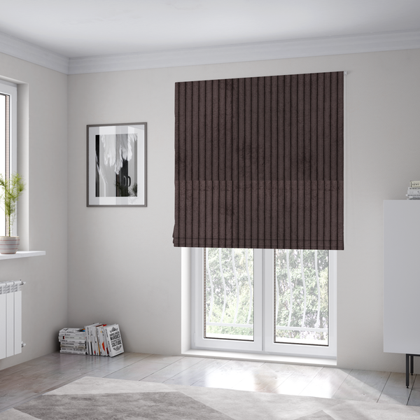 The fabric used to create these Roman blinds is a dark chocolate brown corduroy featuring a consistent vertical ribbed texture.