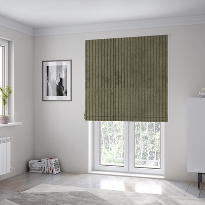 The fabric used to create these Roman blinds is an olive-green corduroy featuring a consistent vertical ribbed texture.