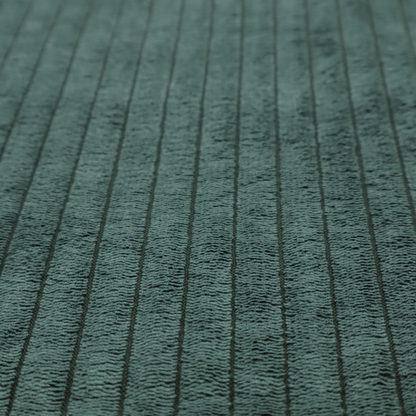 This fabric is a teal-green corduroy featuring a consistent vertical ribbed texture.