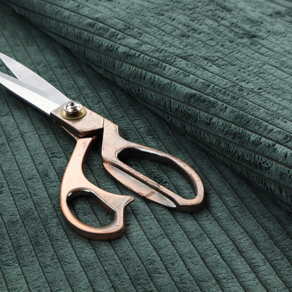 This fabric is a teal-green corduroy featuring a consistent vertical ribbed texture.